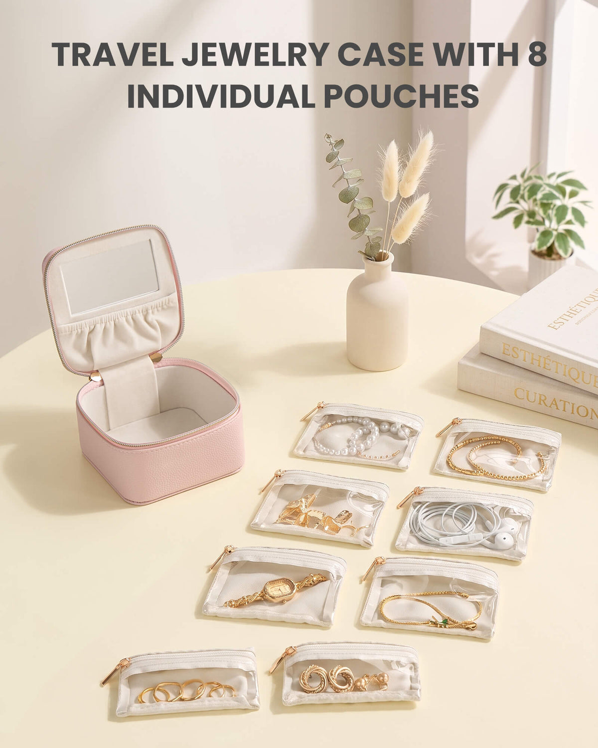 Dustypink portable travel jewelry case with 8 individual pouches with open view showing the interior storage