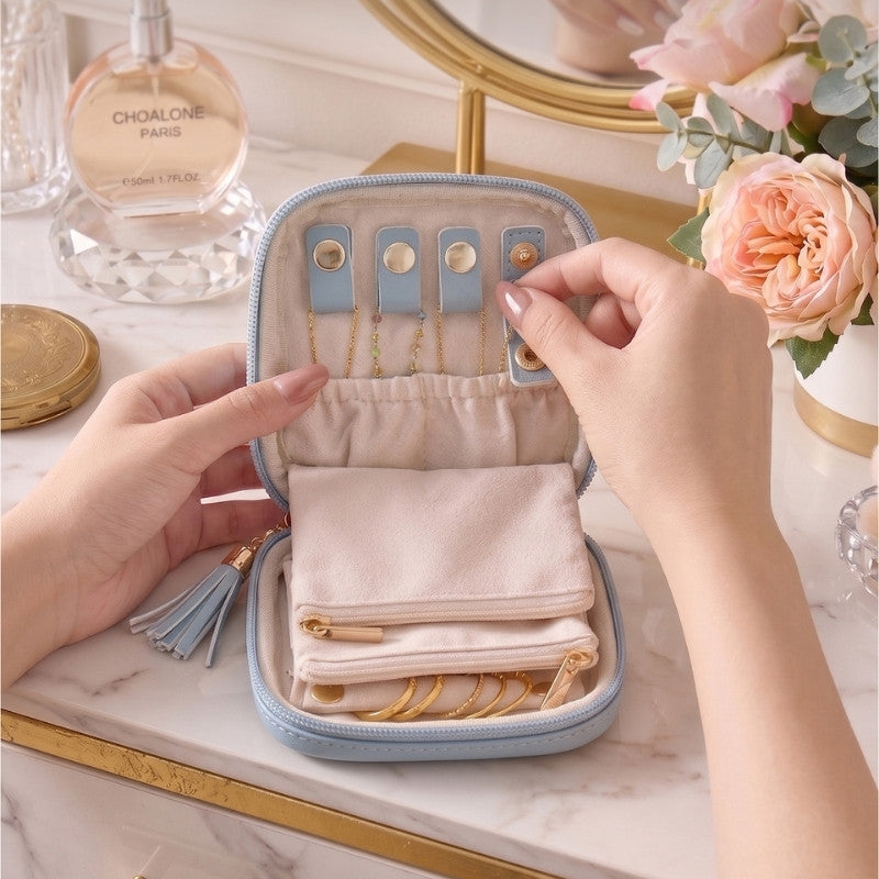 Travel jewelry organizer pouch open with divided storage for small accessories