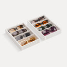 Lolalet 4-grid 2pcs velvet sunglasses organizer tray displayed on a dresser, neatly holding various styles of men's and women's eyewear.