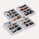 Lolalet 4-grid 4pcs velvet sunglasses organizer tray displayed on a dresser, neatly holding various styles of men's and women's eyewear.
