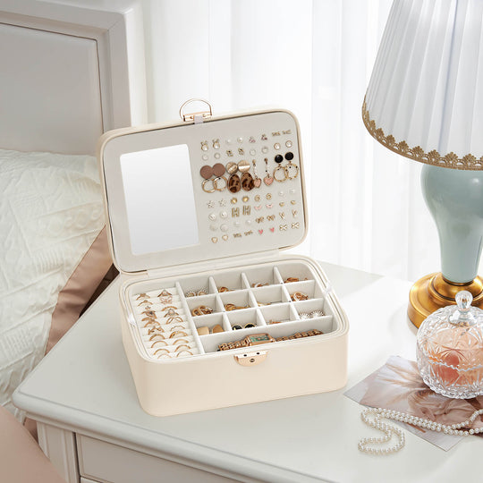 Top-down view of the open cloudwhite Lolalet jewelry box, showing the two layers with compartments for rings, earrings, and necklaces, plus the interior mirror.