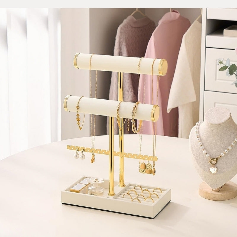 Jewelry organizer stand displaying necklaces, earrings, bracelets, and rings