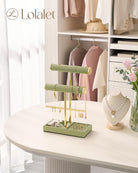 3-tier sage green jewelry organizer stand with necklace bars, earring rack, and ring tray showing full organizer setup