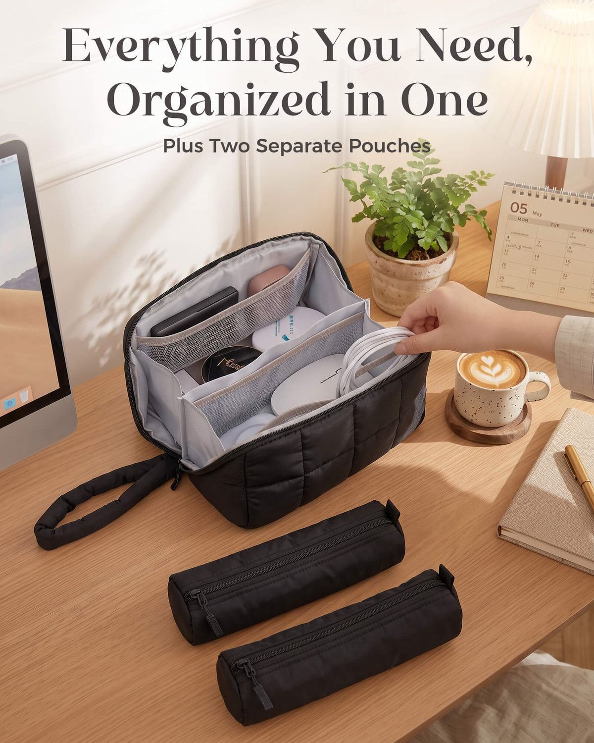 Large black travel organizer open with accessories and two matching zip pouches