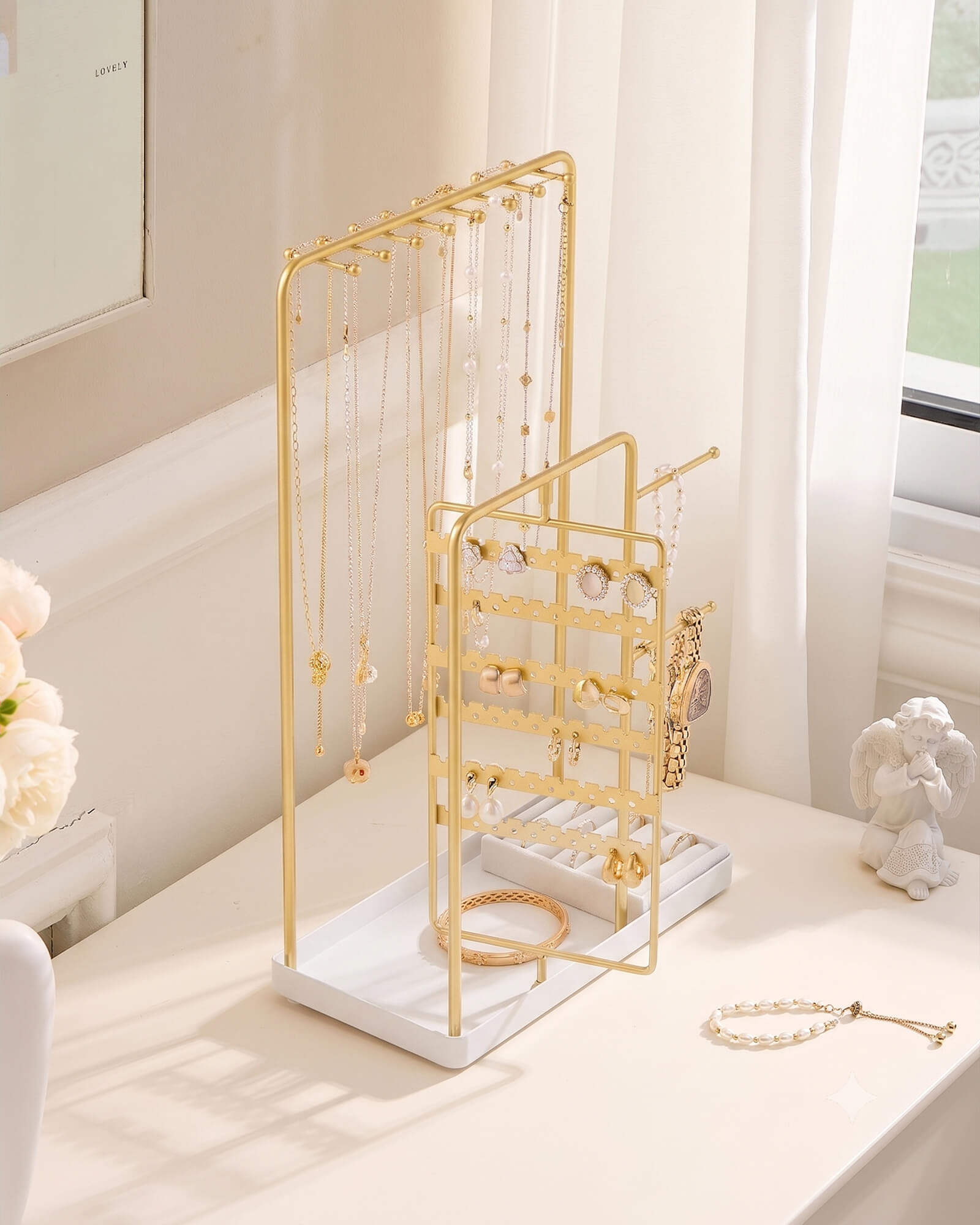 large gold jewelry organizer stand showing velvet ring tray