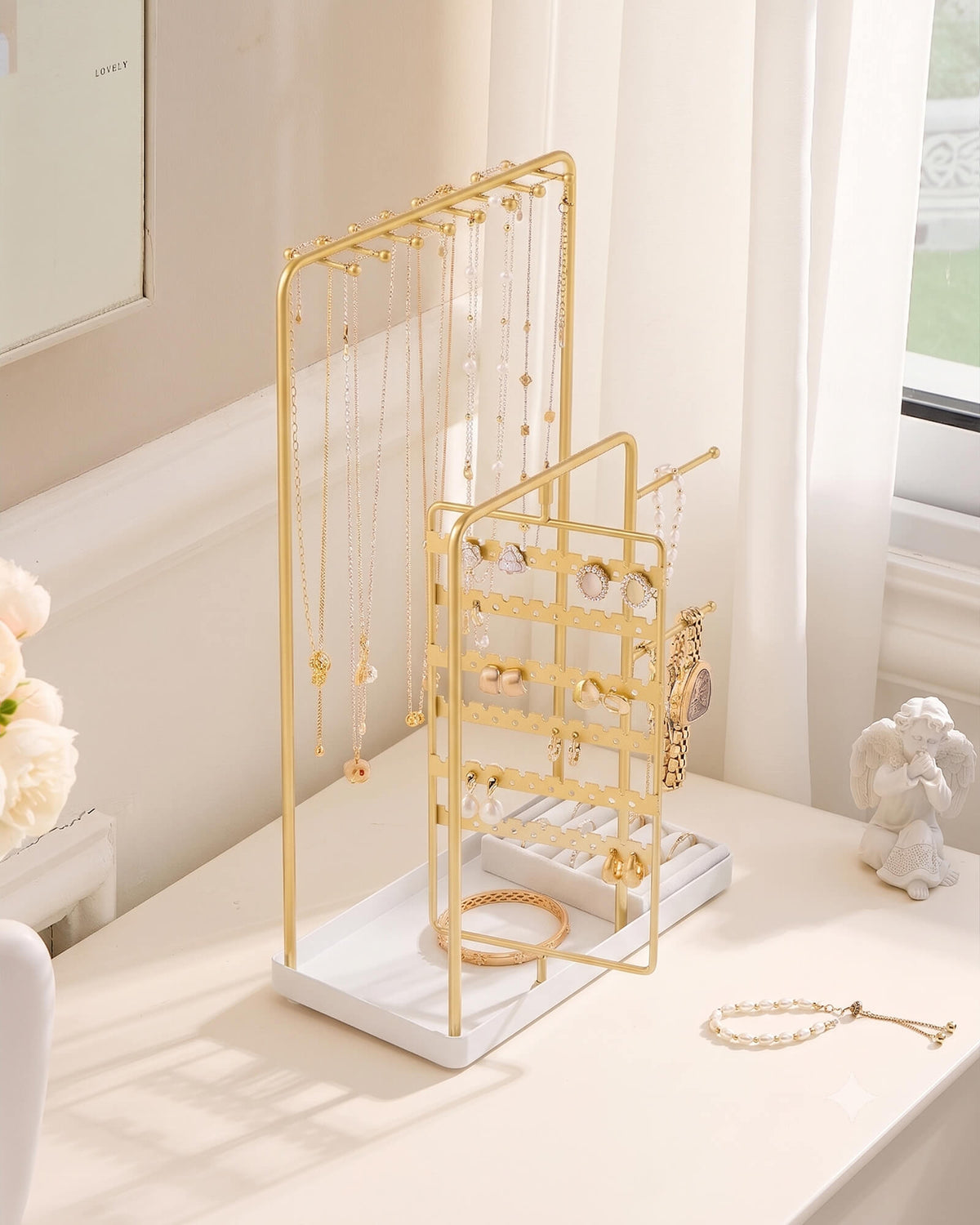 large gold jewelry organizer stand showing velvet ring tray