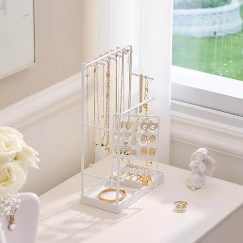 The elegant rotating jewelry tower sitting on a dresser, turning a jewelry collection into a functional piece of decor.