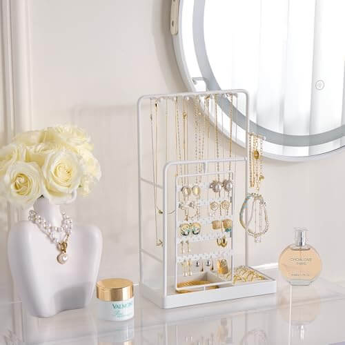 The elegant rotating jewelry tower sitting on a dresser, turning a jewelry collection into a functional piece of decor.